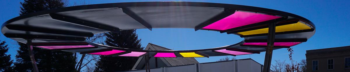 Sculpture with colored panels that the sun shines through.